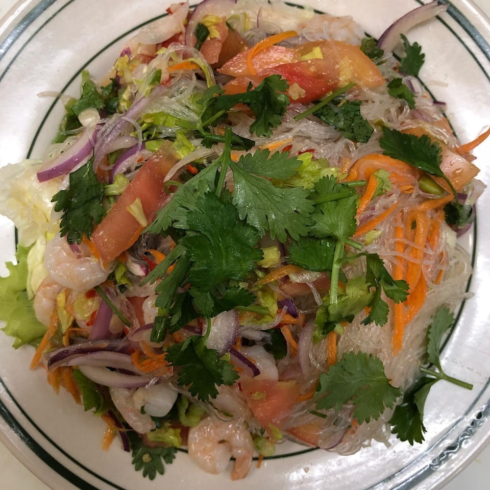 Asian Express glass noodle salad with shrimp, tomatoes, onions, carrots, and cilantro.